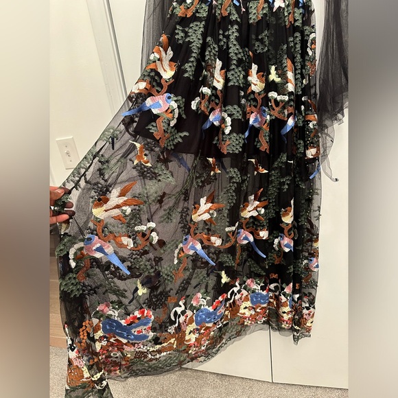 Vibrant beaded dress with a nature scene and she arms - Picture 10 of 11